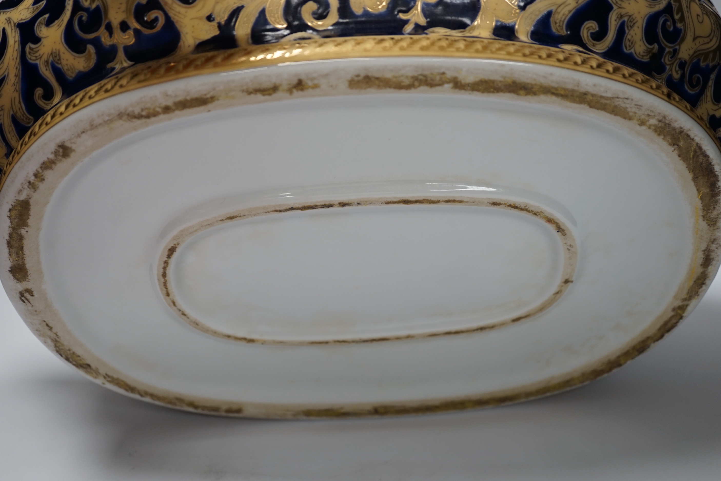 A large Chinese porcelain twin handled bowl decorated with fish and flowers, 44cm wide